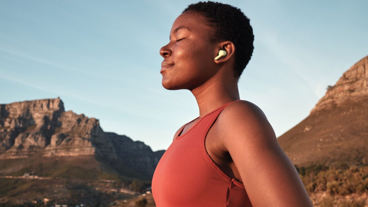 Calm woman exercising outdoors.