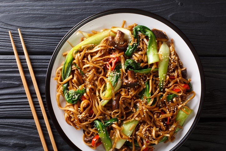 plate of udon noodles and bok choy - with spices that may get into breast millk