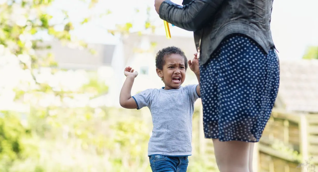 toddler running and hitting mom